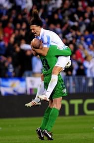 Malaga's Martin Demichelis (R) and goalkeeper Willy Caballero (L) celebrate in Malaga on March 13, 2013